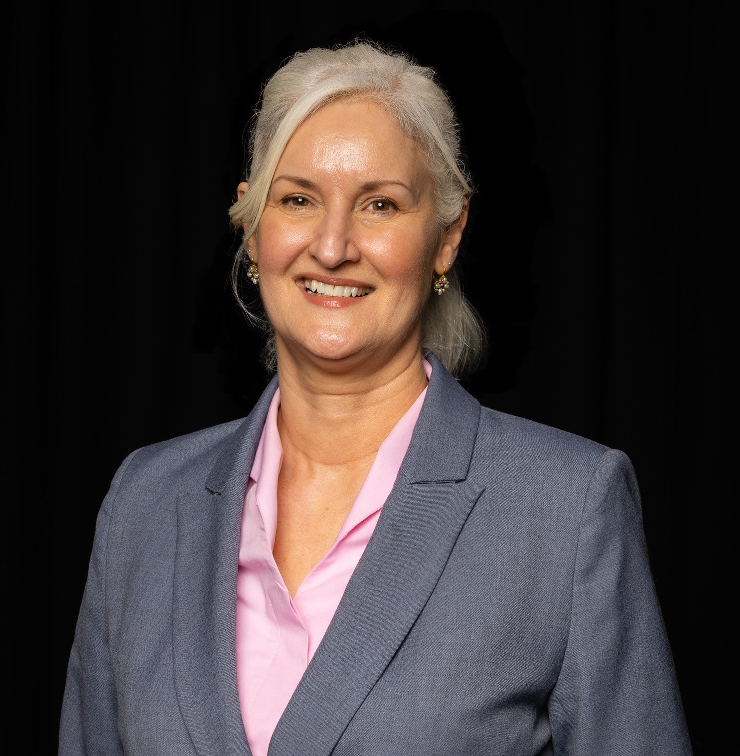 a photo of Deborah Johnston against a black background.