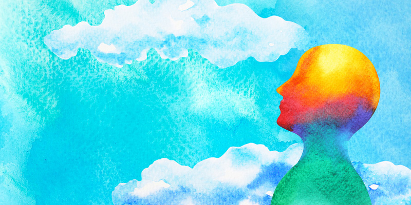 abstract image of person looking up at clouds and blue sky